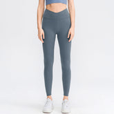 Hoog getailleerde gekruiste effen legging