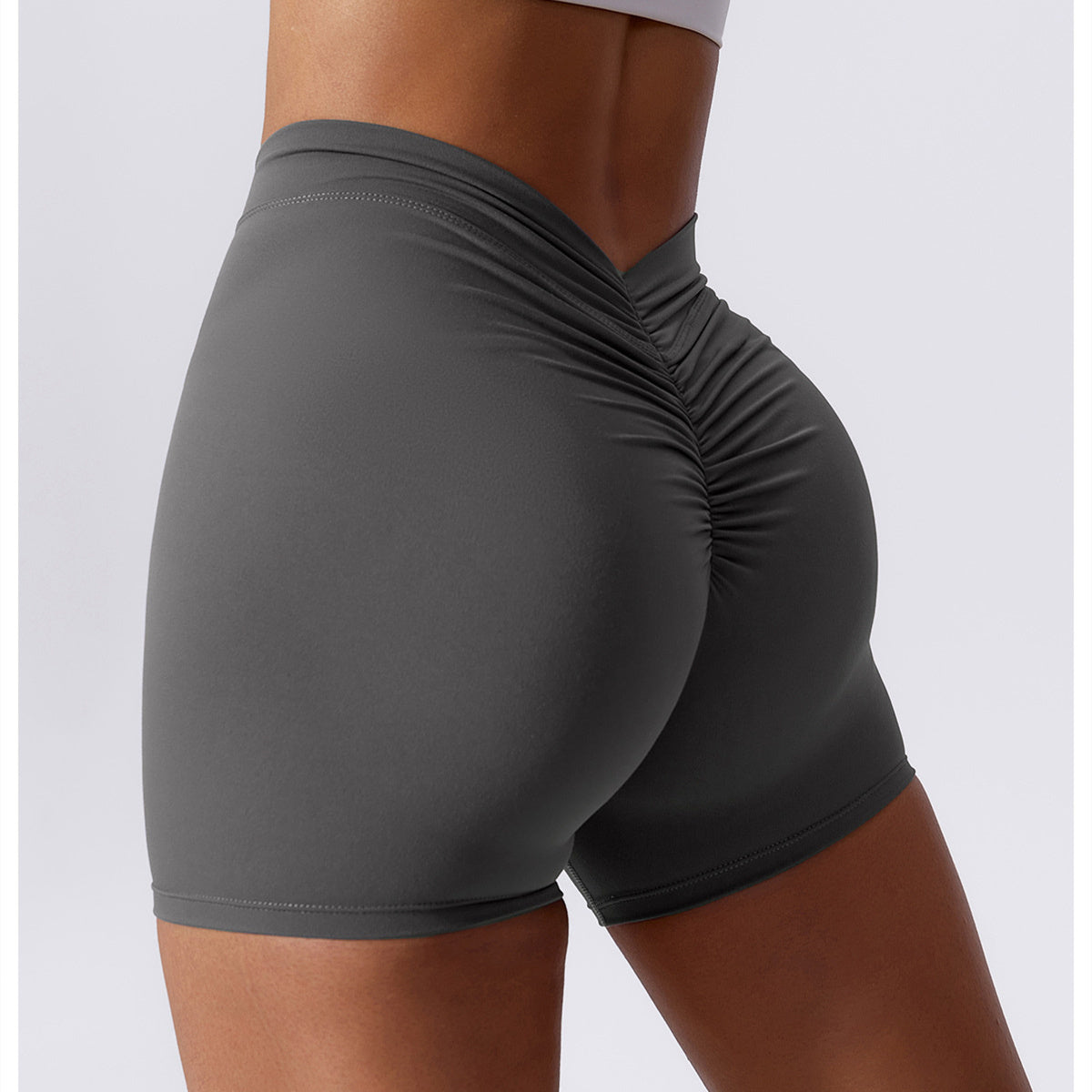 Hoog getailleerde V-vormige yogashort met ruches